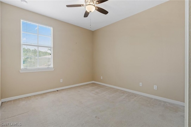 carpeted empty room with ceiling fan