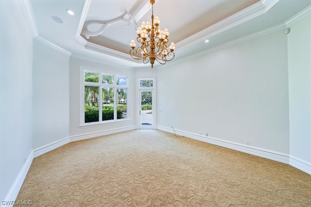 unfurnished room with a notable chandelier, crown molding, a raised ceiling, and light colored carpet