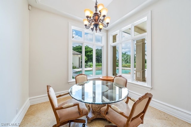 dining area featuring a notable chandelier