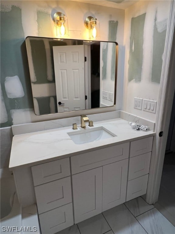 bathroom with vanity and tile flooring