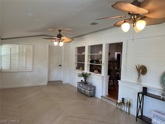 empty room with light parquet floors and ceiling fan