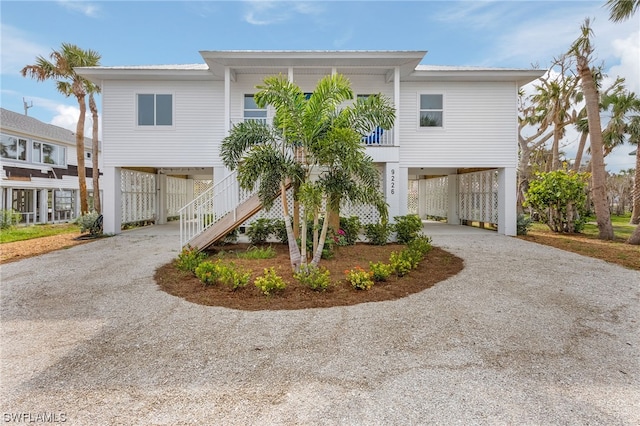 raised beach house with a carport