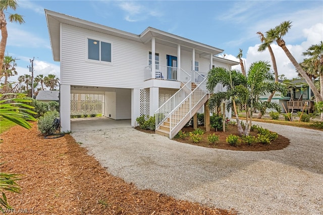 coastal inspired home featuring covered porch