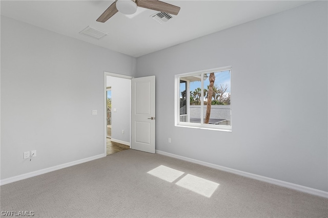 empty room with carpet and ceiling fan