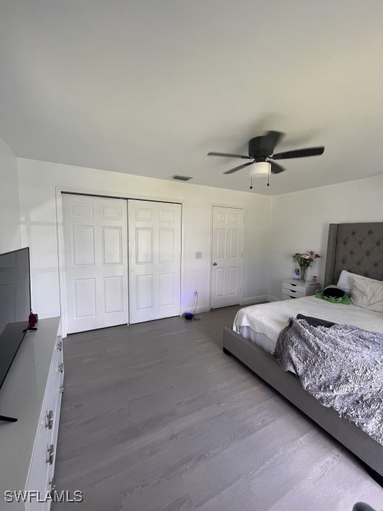 bedroom with hardwood / wood-style floors and ceiling fan