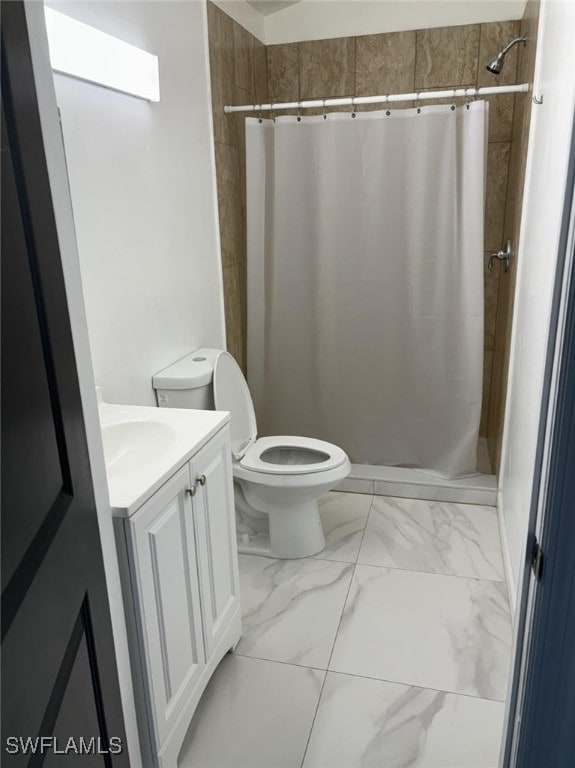 bathroom with vanity, toilet, and walk in shower