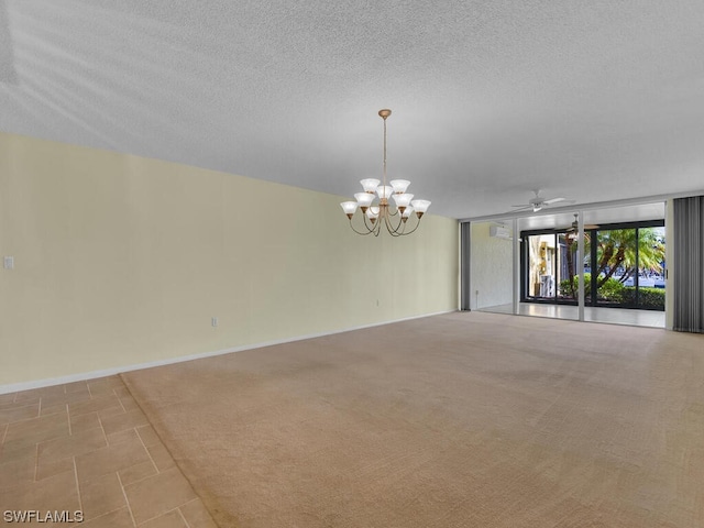 spare room with a textured ceiling, ceiling fan with notable chandelier, and light tile flooring