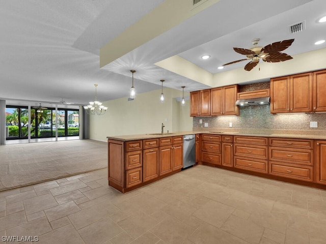 kitchen featuring decorative light fixtures, ceiling fan with notable chandelier, backsplash, dishwasher, and sink