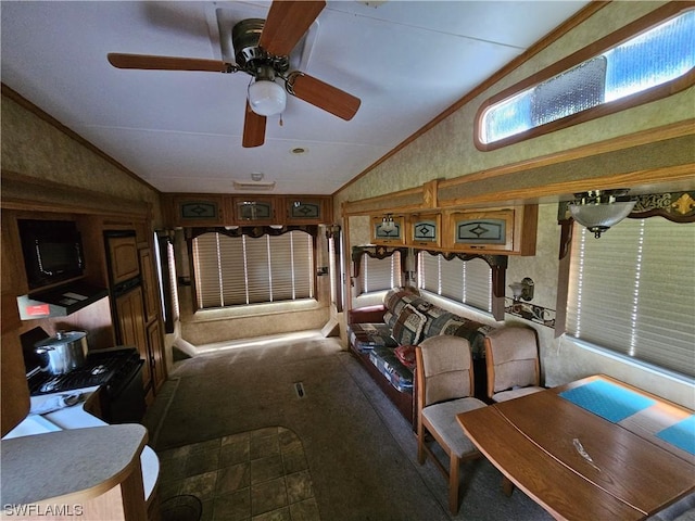 bedroom with lofted ceiling, crown molding, and carpet floors