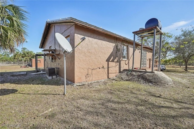 view of home's exterior with a yard