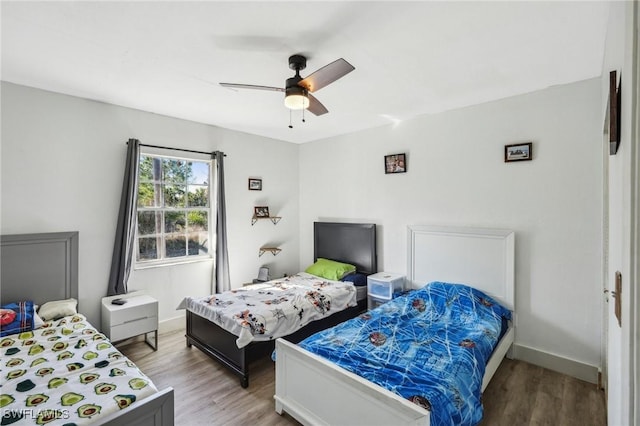 bedroom featuring ceiling fan and light wood-type flooring