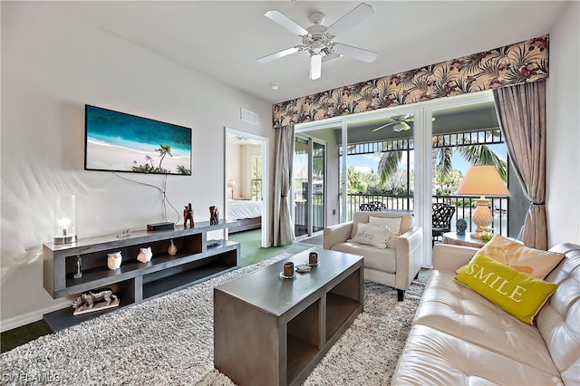 living room featuring ceiling fan and carpet flooring