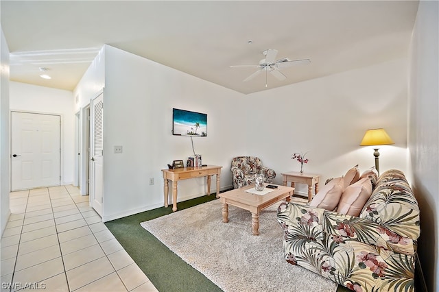 tiled living room featuring ceiling fan