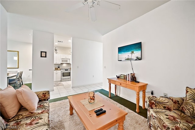 tiled living room with ceiling fan