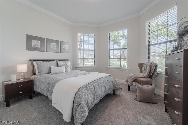 carpeted bedroom featuring ornamental molding