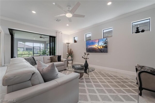 living room with ceiling fan and ornamental molding