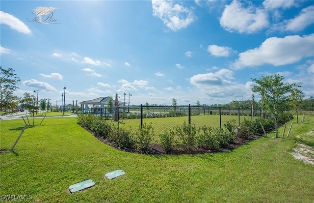 view of property's community featuring a gazebo and a lawn