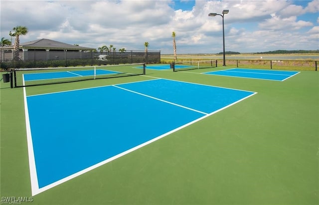 view of sport court featuring basketball hoop