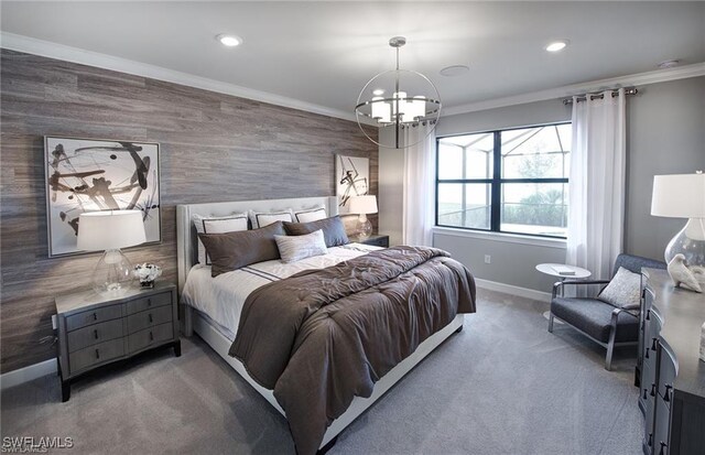 bedroom with a chandelier, ornamental molding, and carpet