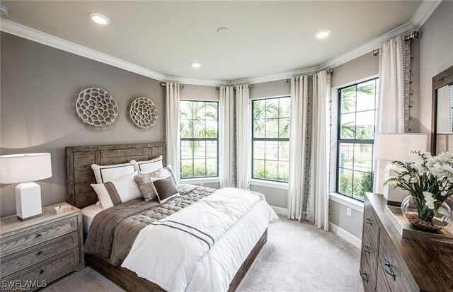 bedroom featuring ornamental molding and light carpet