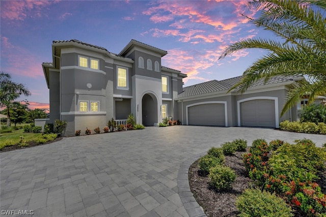 mediterranean / spanish house featuring a garage