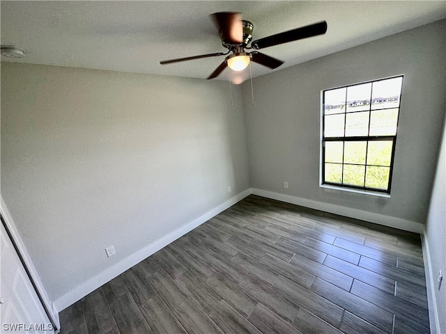 empty room with ceiling fan and wood-type flooring