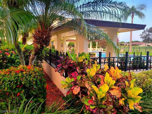 surrounding community featuring fence and a pool