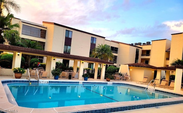 community pool featuring a patio area