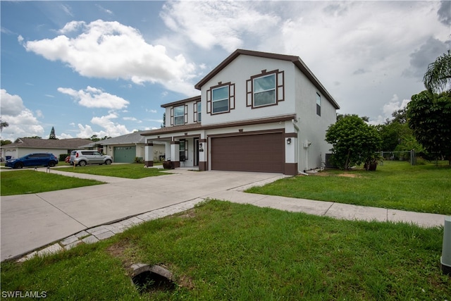 front of property featuring a front yard and a garage