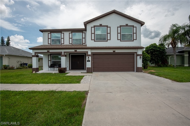 view of front facade featuring a front yard and a garage