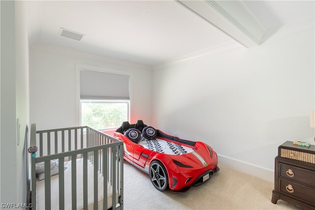 carpeted bedroom featuring ornamental molding