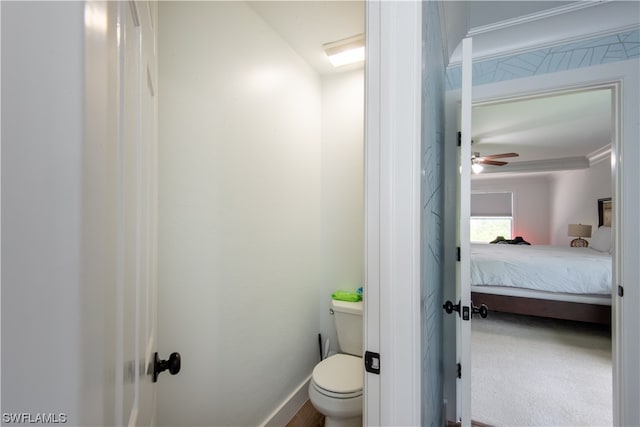 bathroom featuring toilet and ceiling fan