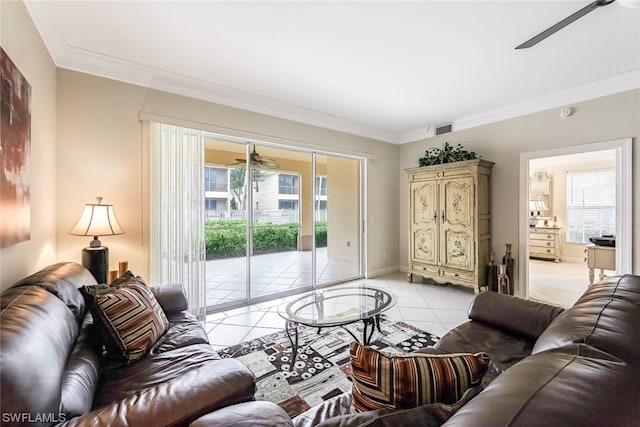 living room with light tile flooring, ceiling fan, and crown molding