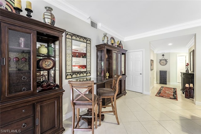 tiled dining area with crown molding