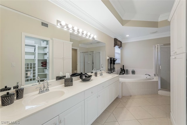 bathroom featuring independent shower and bath, crown molding, dual sinks, and vanity with extensive cabinet space