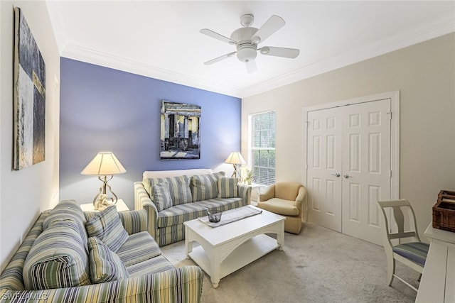 living room featuring ornamental molding, ceiling fan, and light colored carpet