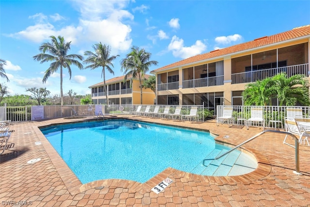 view of swimming pool featuring a patio area