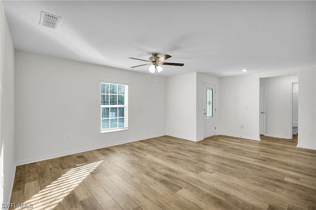 empty room featuring light hardwood / wood-style floors and ceiling fan