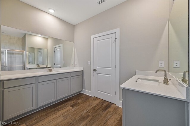 bathroom featuring vanity and hardwood / wood-style flooring