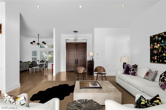 living room with ceiling fan and dark hardwood / wood-style floors