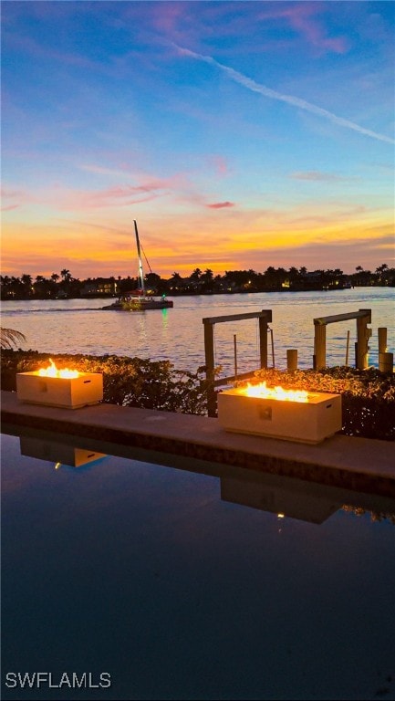 view of dock with a water view