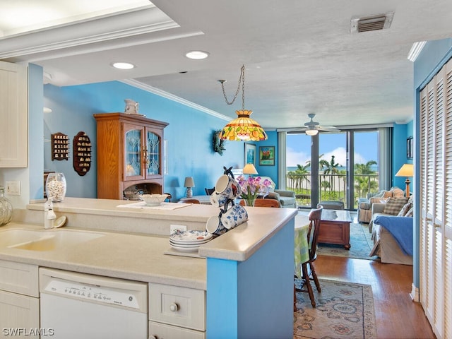 kitchen with dark hardwood / wood-style floors, pendant lighting, ceiling fan, dishwasher, and white cabinetry