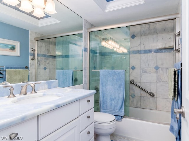 full bathroom featuring combined bath / shower with glass door, tile floors, toilet, oversized vanity, and ornamental molding