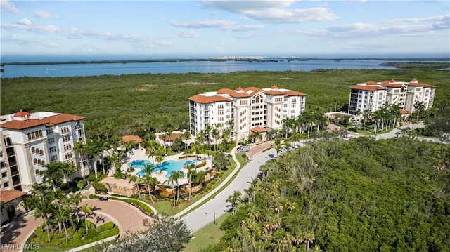 birds eye view of property with a water view