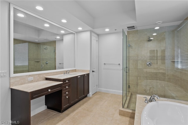 bathroom featuring vanity, plus walk in shower, and tile patterned flooring