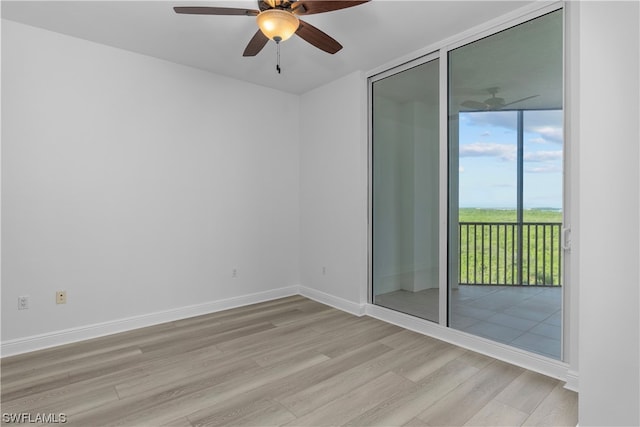 empty room featuring ceiling fan and light hardwood / wood-style floors