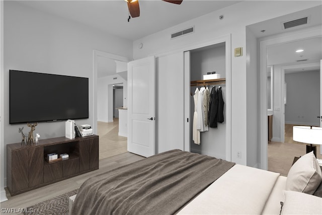 bedroom featuring ceiling fan and a closet