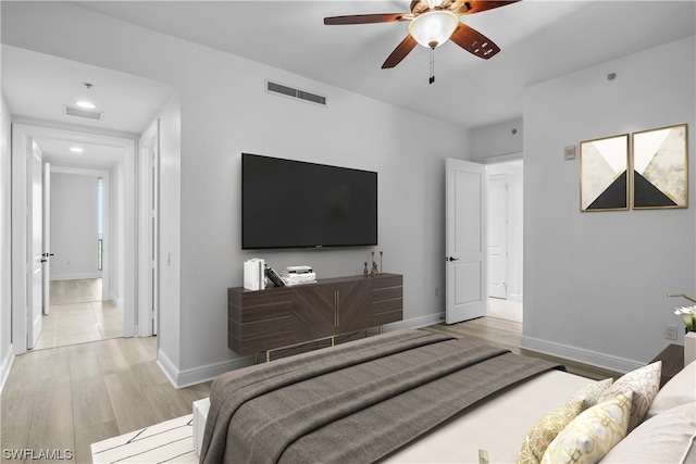 bedroom featuring ceiling fan and light hardwood / wood-style floors