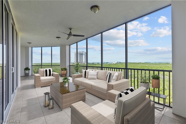 sunroom featuring a wealth of natural light and ceiling fan