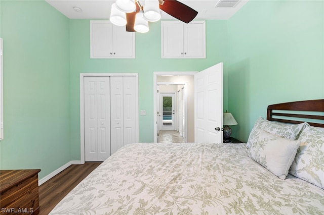 bedroom featuring ceiling fan, a closet, and dark hardwood / wood-style floors